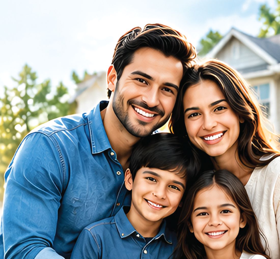 Smiling family of four in front of their home